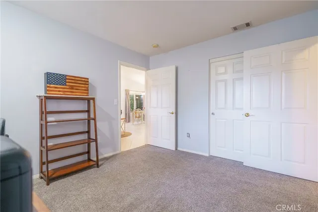 a view of walk in closet with clothes