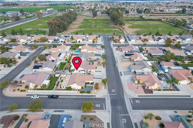 an aerial view of a house with a lake view
