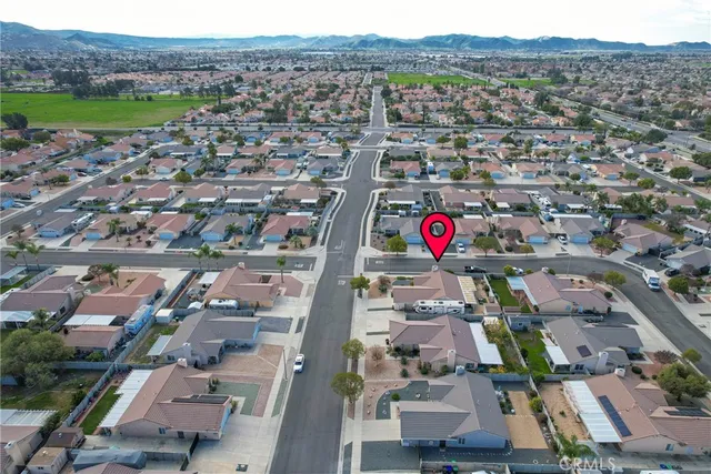 an aerial view of residential houses and outdoor space