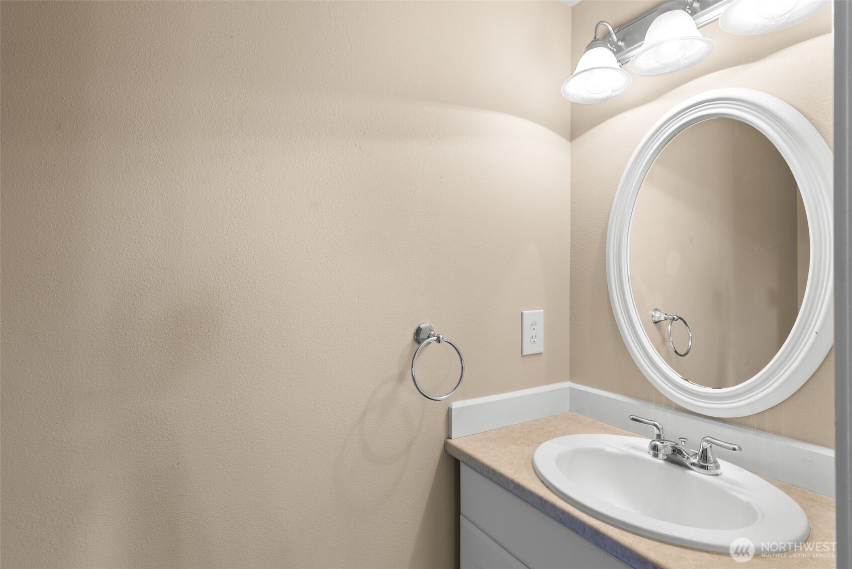 26227 Montera Loop Northeast Kingston, WA 98346 - Photo 12 of 22 a bathroom with a sink and a mirror