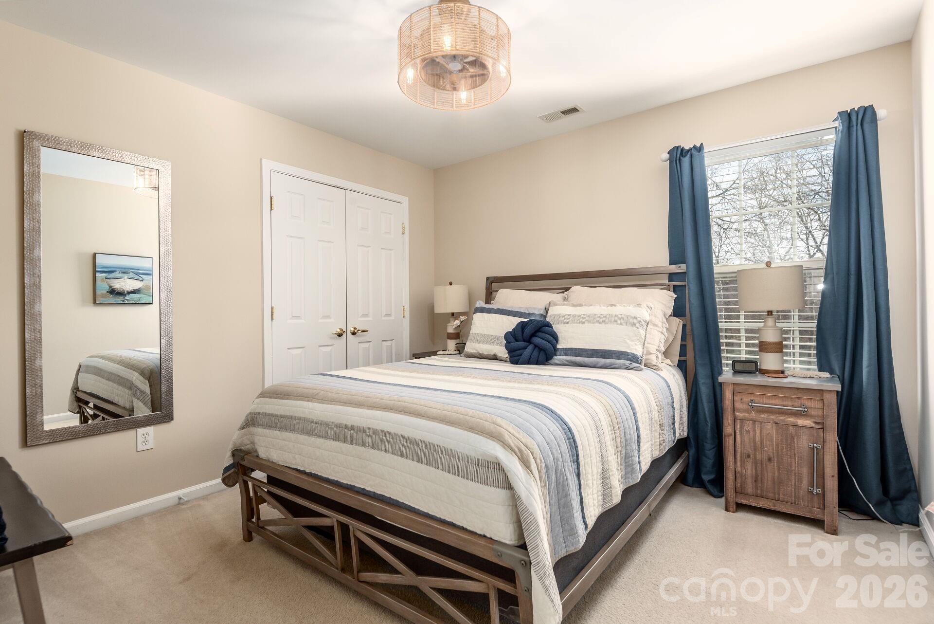 156 Lighthouse Road Mount Holly, NC 28120 - Photo 17 of 39 a bedroom with a bed and a window