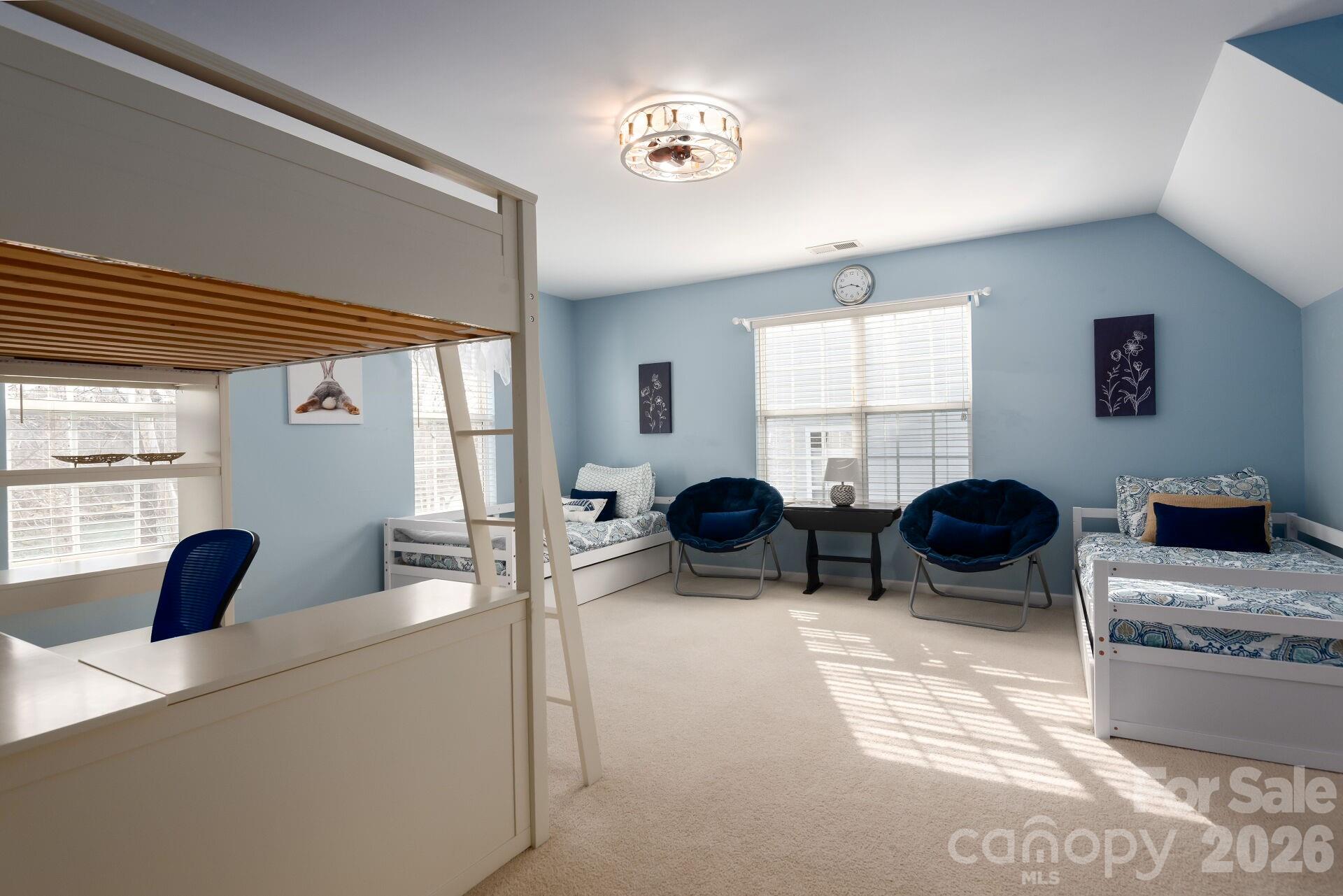 156 Lighthouse Road Mount Holly, NC 28120 - Photo 20 of 39 a living room with furniture a large window and flat screen tv