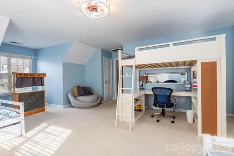 a view of a workspace with furniture