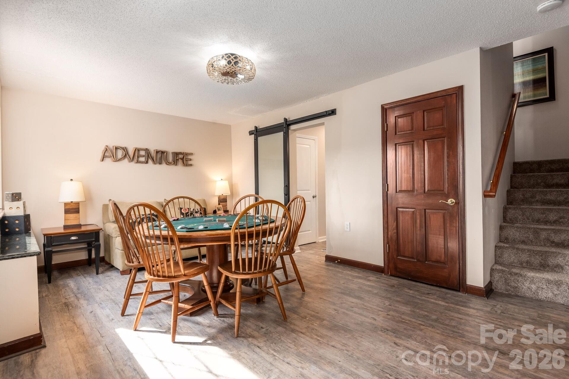 156 Lighthouse Road Mount Holly, NC 28120 - Photo 23 of 39 a view of a dining room with furniture window and wooden floor