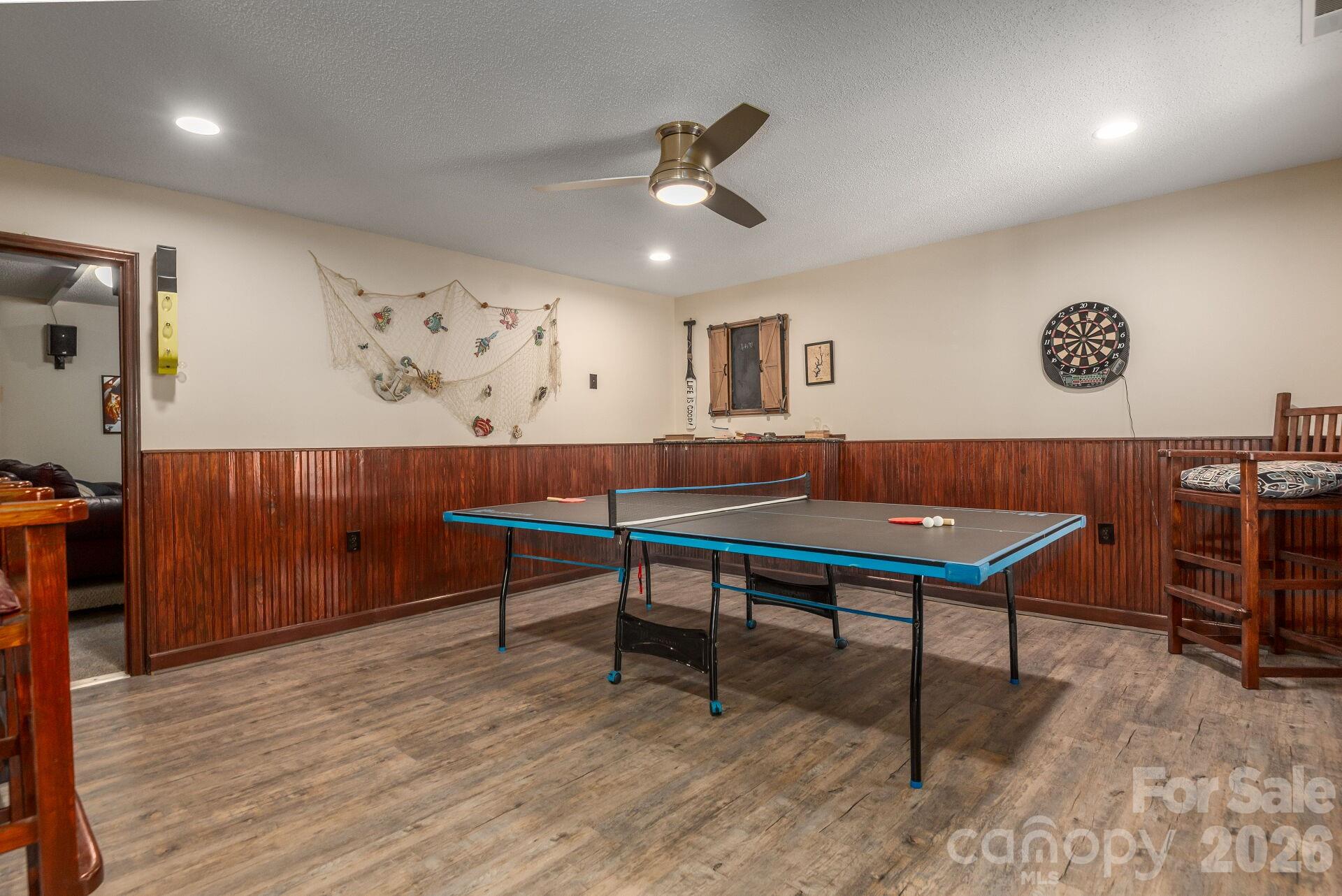 156 Lighthouse Road Mount Holly, NC 28120 - Photo 25 of 39 a living room with furniture and a wooden floor