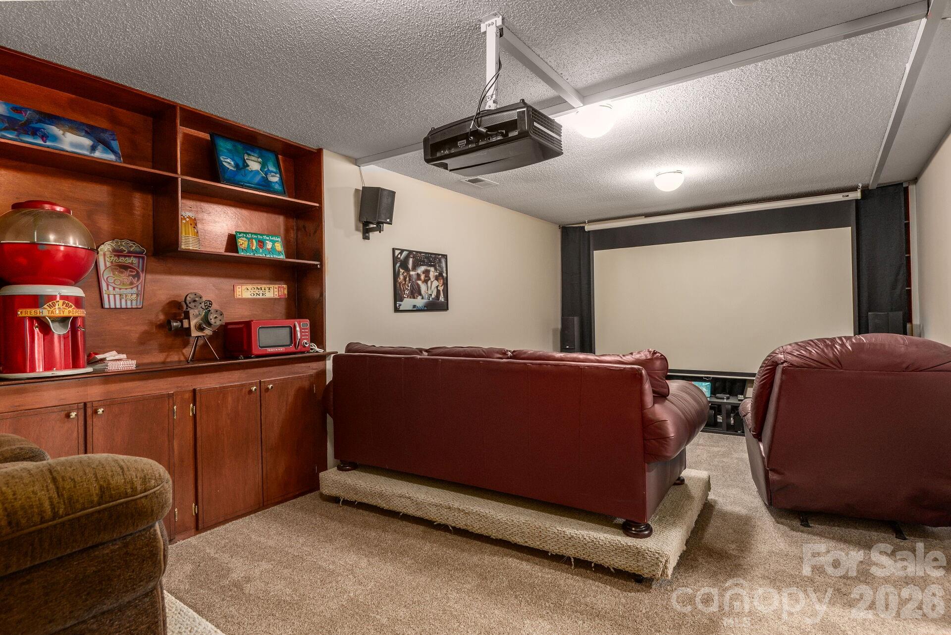 156 Lighthouse Road Mount Holly, NC 28120 - Photo 27 of 39 a living room with hard wood walls and furniture
