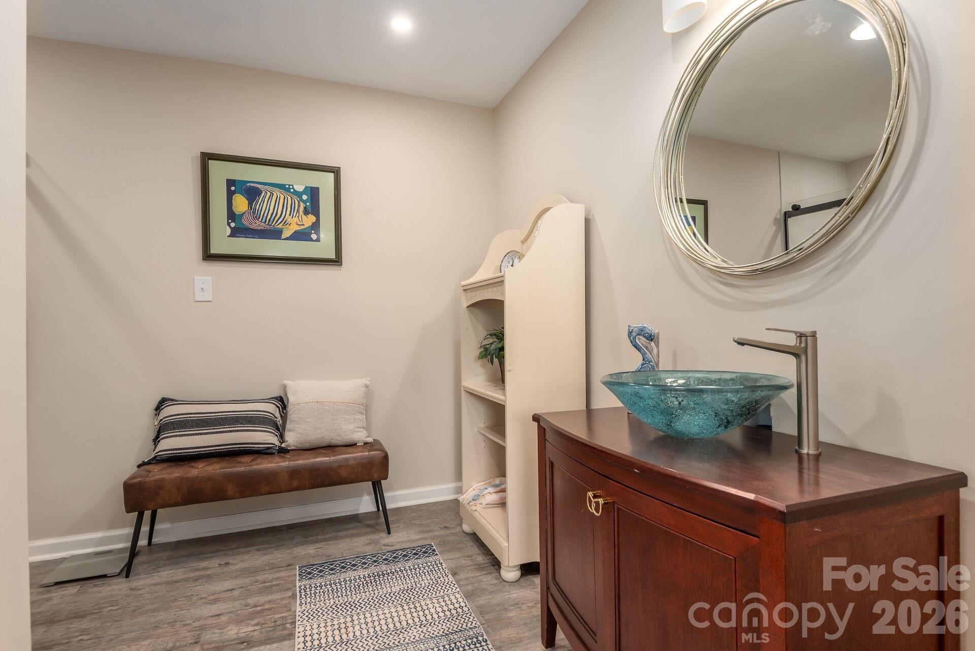 156 Lighthouse Road Mount Holly, NC 28120 - Photo 30 of 39 a room with furniture and a mirror