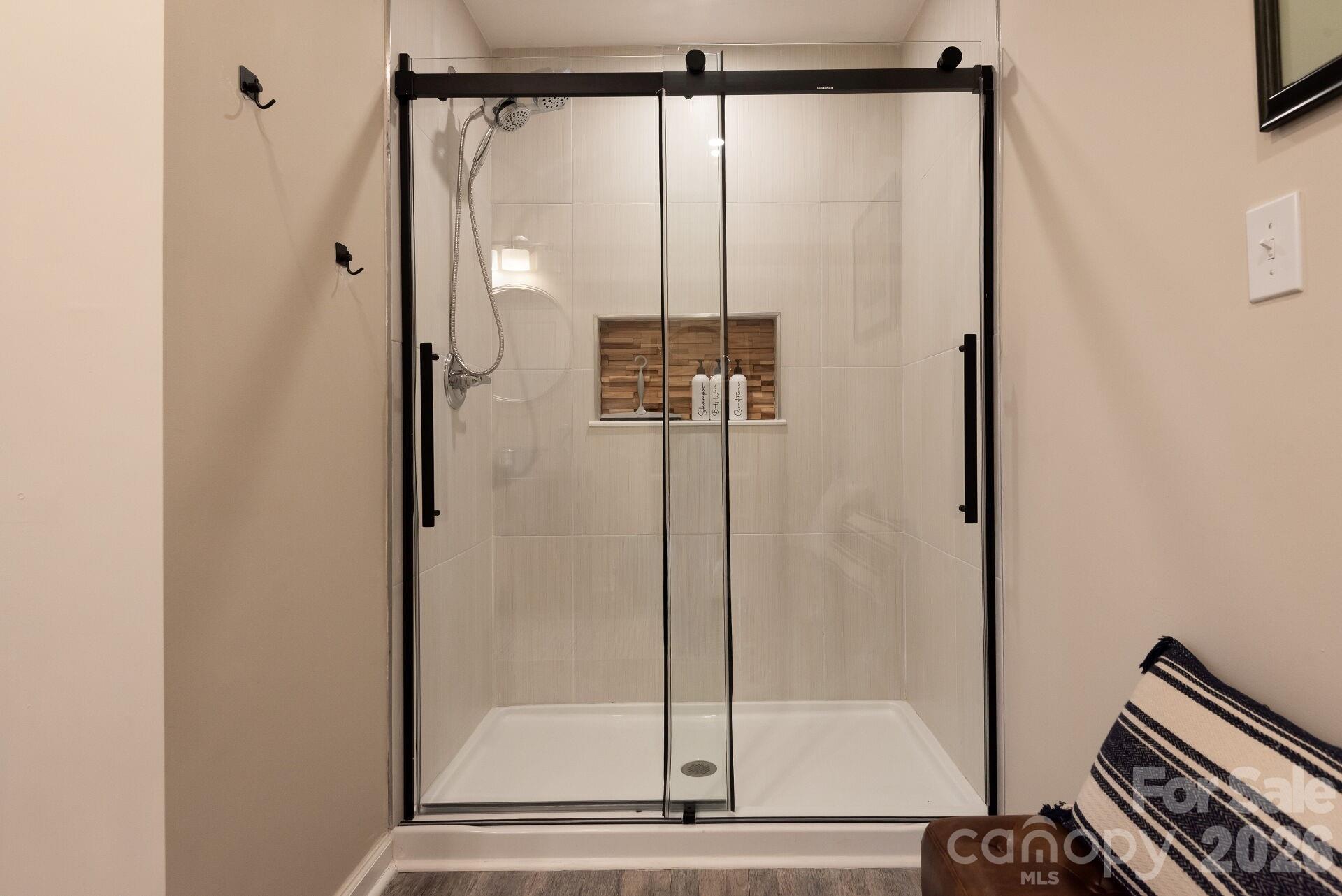 156 Lighthouse Road Mount Holly, NC 28120 - Photo 31 of 39 a bathroom with a glass shower door