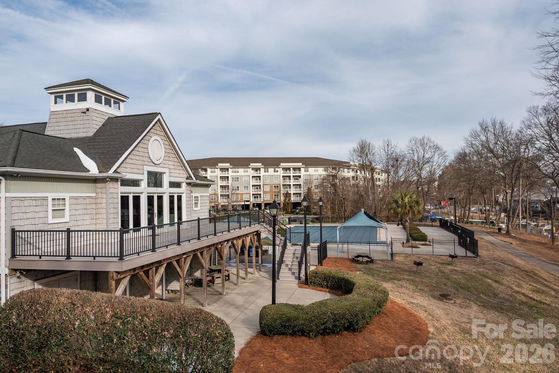 156 Lighthouse Road Mount Holly, NC 28120 - Photo 35 of 39 a view of a house with backyard and porch