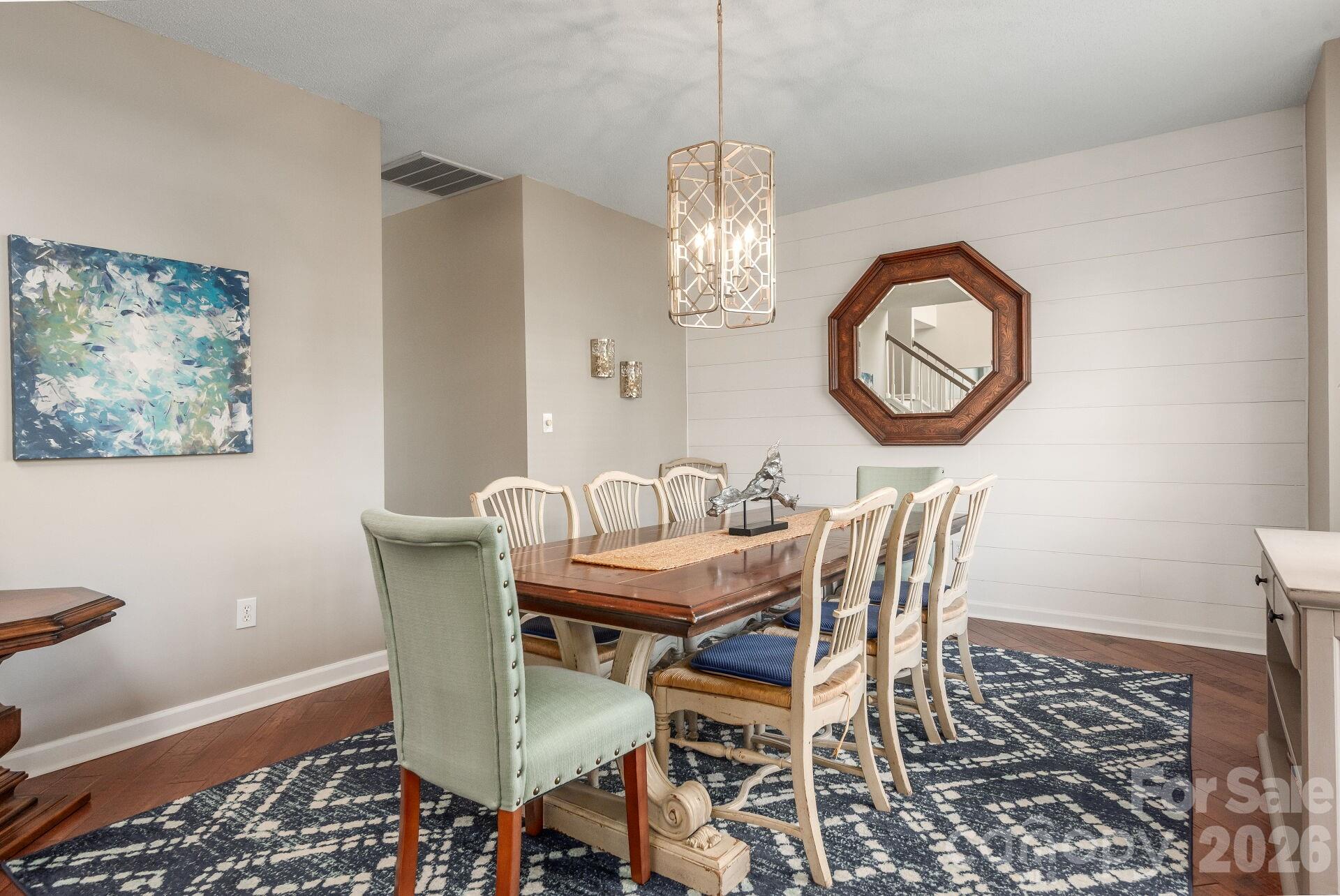 156 Lighthouse Road Mount Holly, NC 28120 - Photo 5 of 39 a view of a dining room with furniture and chandelier
