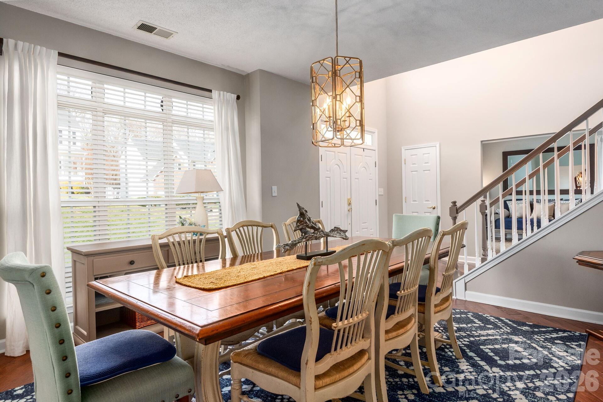 156 Lighthouse Road Mount Holly, NC 28120 - Photo 6 of 39 a view of a dining room with furniture window and outside view