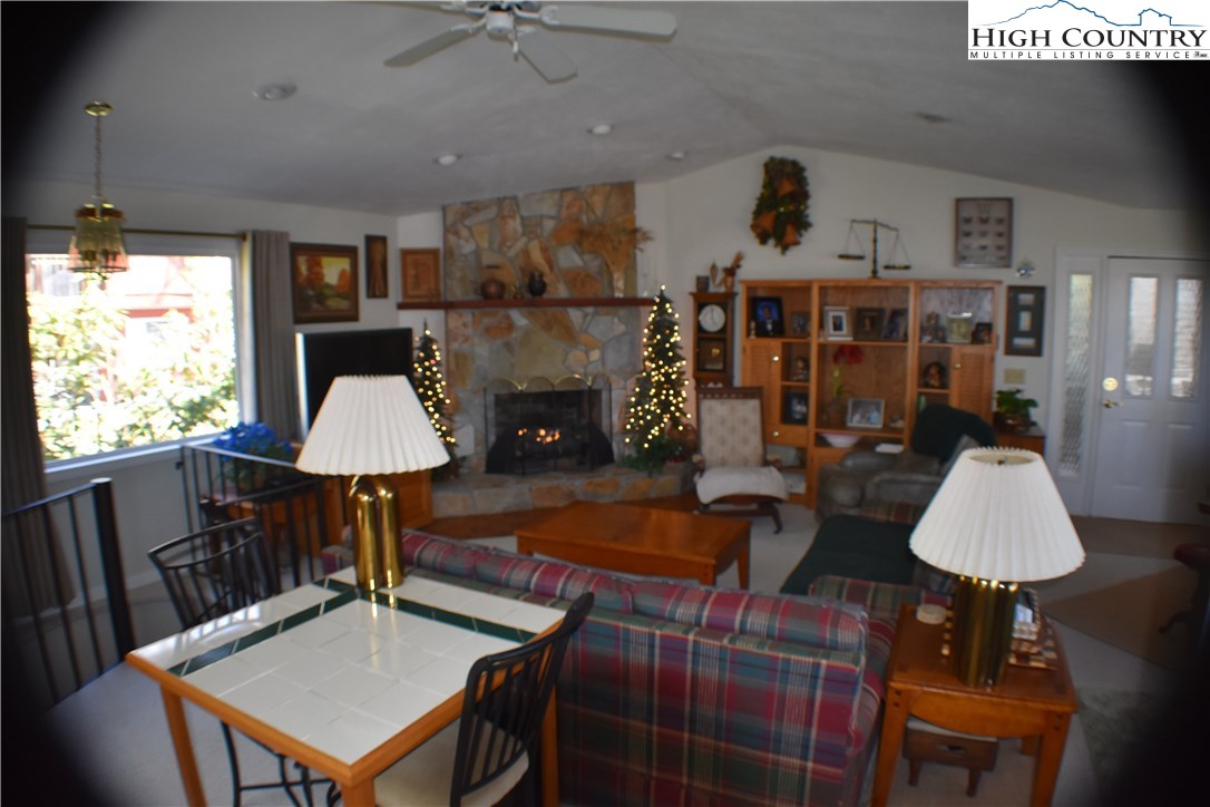 258 Ivy Road Newland, NC 28657 - Photo 13 of 26 a living room with furniture a window and a flat screen tv