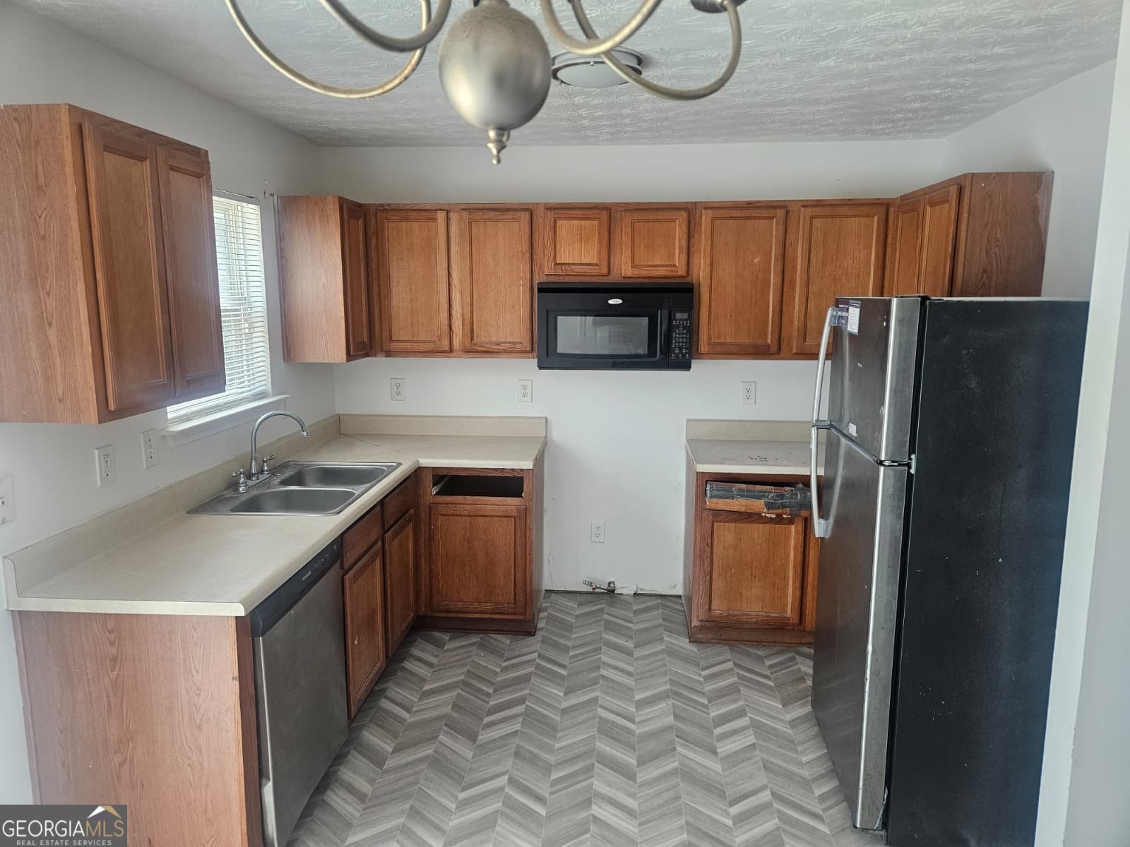 9432 Lakeview Road, Unit 53 Union City, GA 30291 - Photo 2 of 10 a kitchen with stainless steel appliances granite countertop a refrigerator a stove a sink and dishwasher