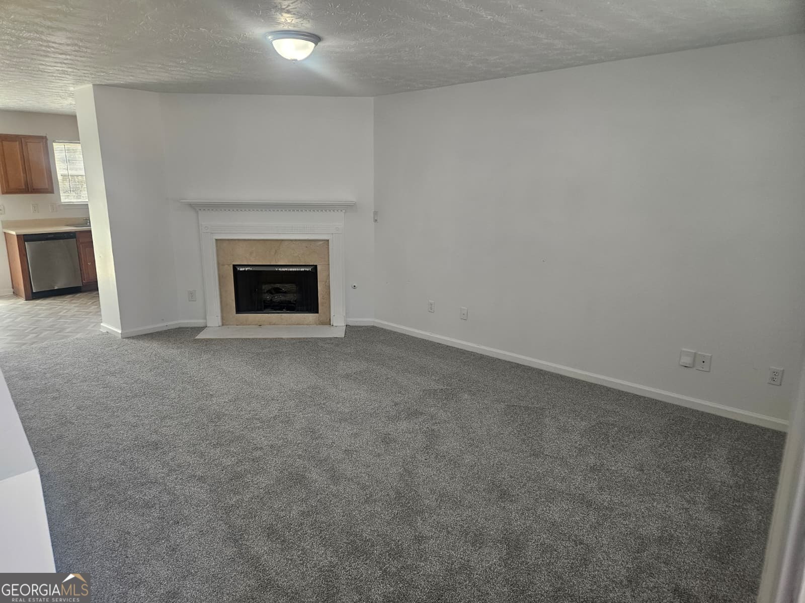 9432 Lakeview Road, Unit 53 Union City, GA 30291 - Photo 4 of 10 a view of an empty room with a fireplace