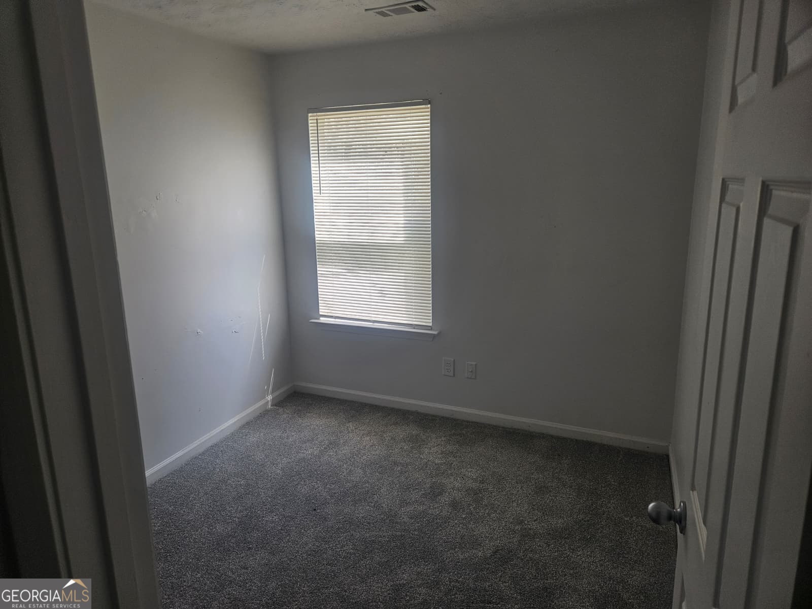 9432 Lakeview Road, Unit 53 Union City, GA 30291 - Photo 6 of 10 an empty room with a window
