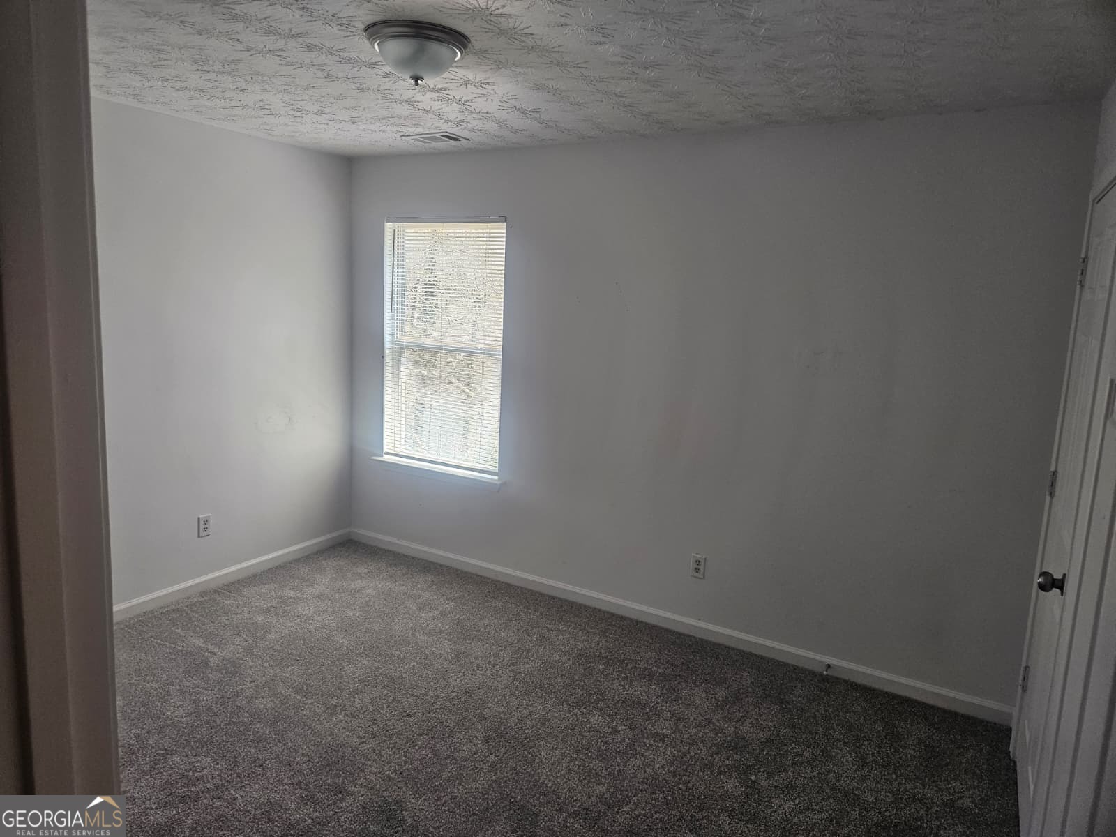 9432 Lakeview Road, Unit 53 Union City, GA 30291 - Photo 8 of 10 a view of an empty room with a window