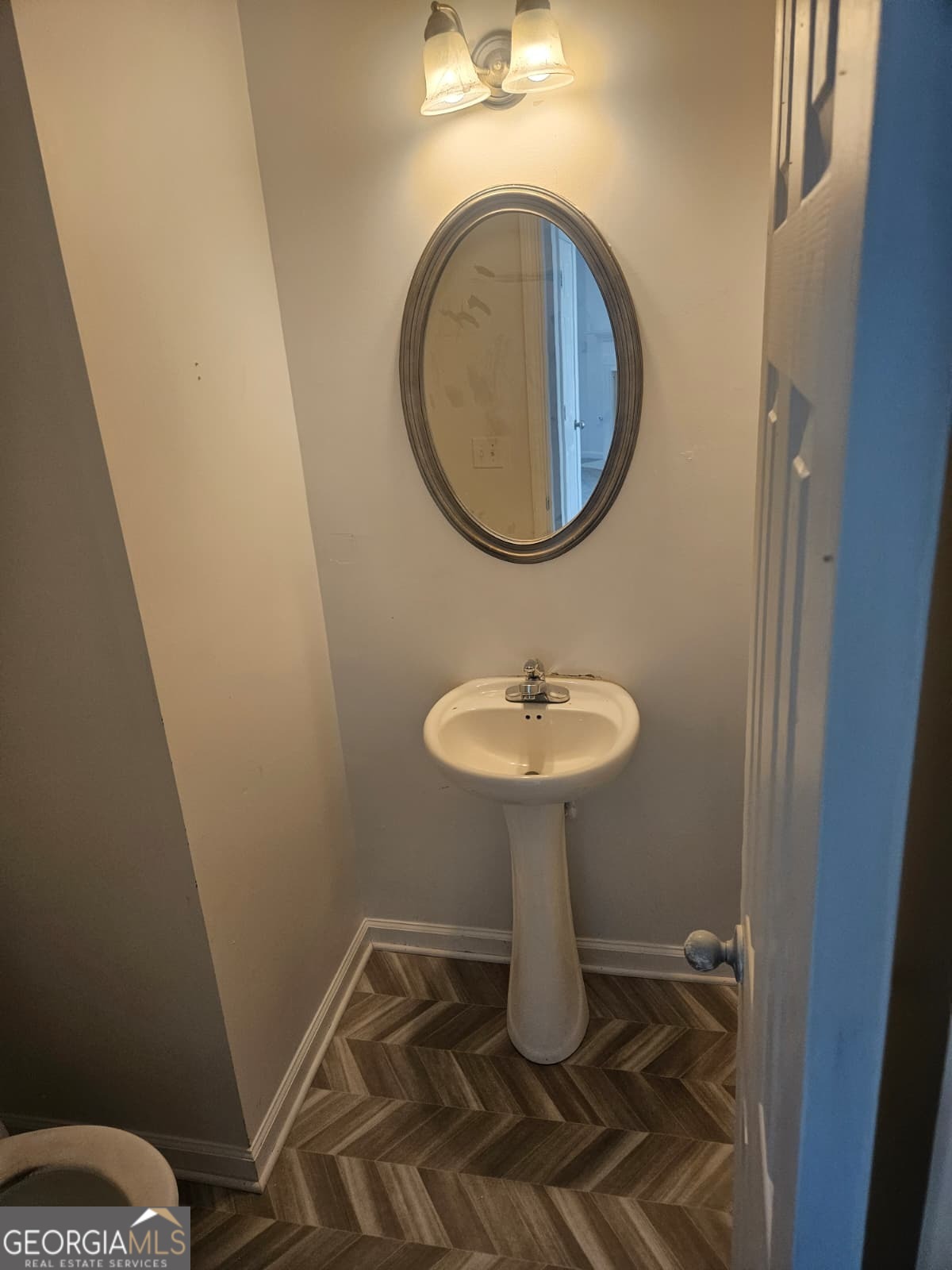 9432 Lakeview Road, Unit 53 Union City, GA 30291 - Photo 9 of 10 a bathroom with a sink toilet and a mirror