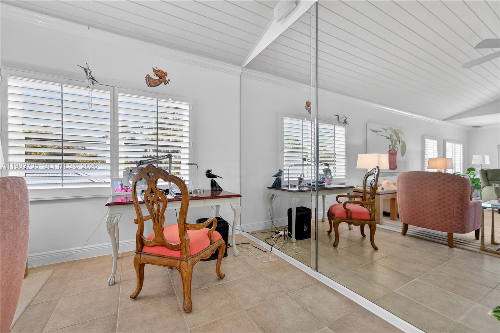 851 Saturn Street, Unit D Jupiter, FL 33477 - Photo 15 of 60 a room with furniture and a window