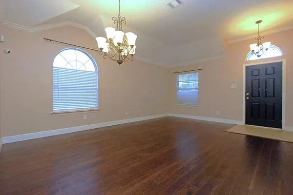 a view of a livingroom with wooden floor