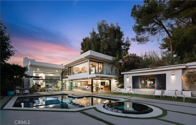 a front view of a house with swimming pool