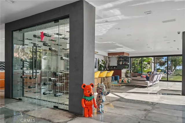 a living room with furniture and potted plant