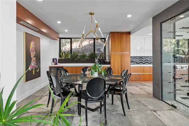 a living room with furniture a fireplace and a large window