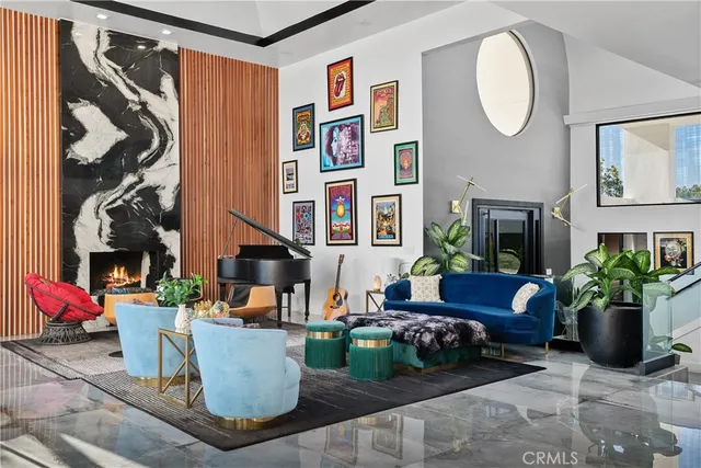 a kitchen with stainless steel appliances granite countertop a refrigerator a stove and a sink