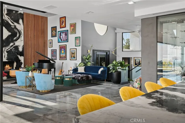 a view of a living room and kitchen floor to ceiling window