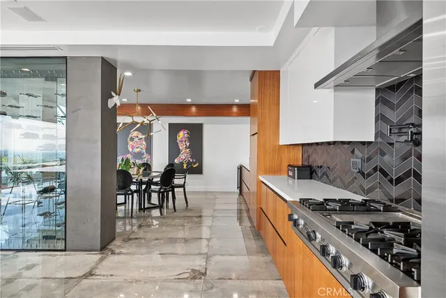 a sitting area with furniture and a floor to ceiling window