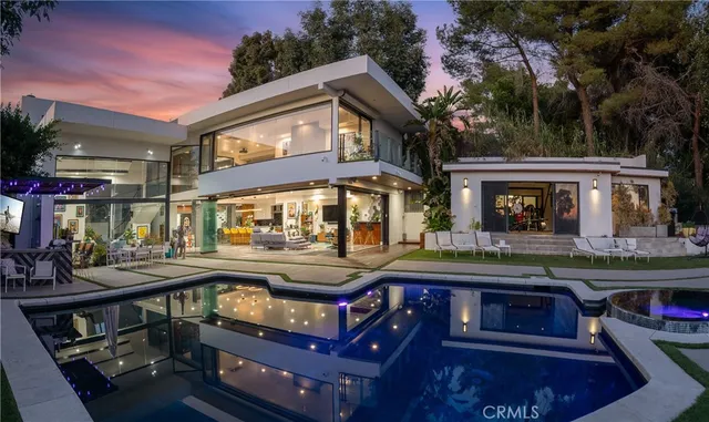 a front view of a house with tub and trees