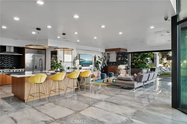 a balcony with furniture and a floor to ceiling window