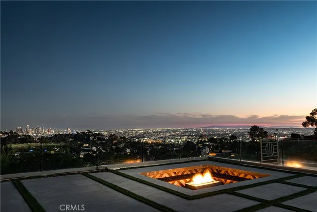 a swimming pool with outdoor seating and yard