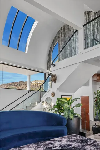 a dining room with furniture a rug and a chandelier