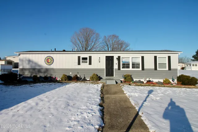 a view of a house with outdoor space and sitting area