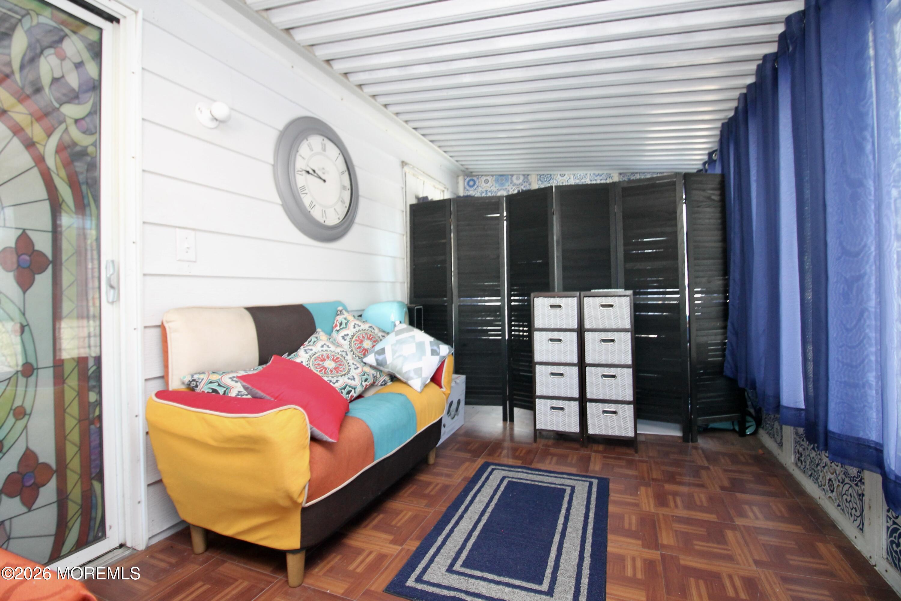 509 Rosalind Road Freehold, NJ 07728 - Photo 19 of 24 a bedroom with a bed a mirror and a table in it