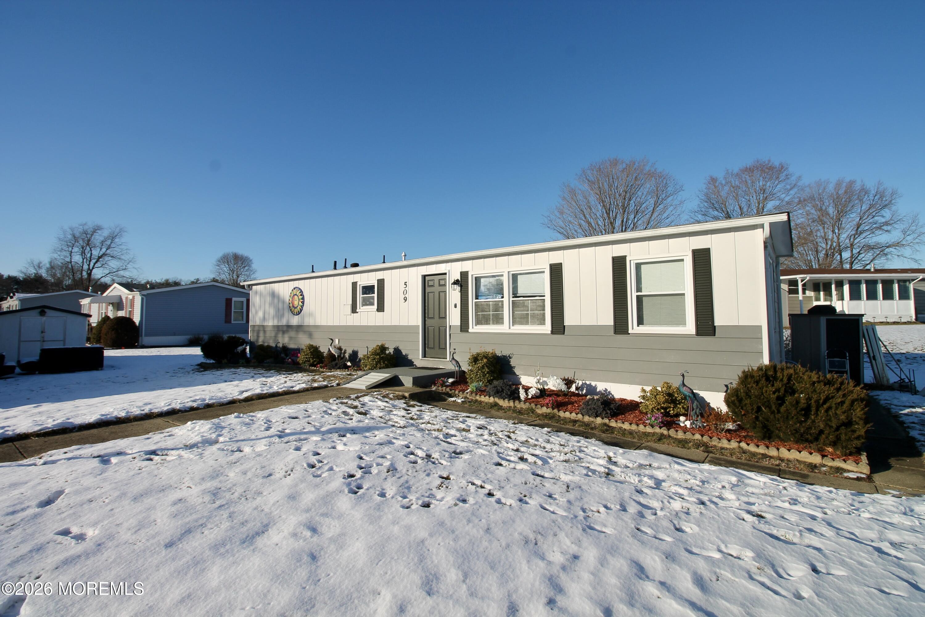 509 Rosalind Road Freehold, NJ 07728 - Photo 2 of 24 a backyard of a house with yard and outdoor seating