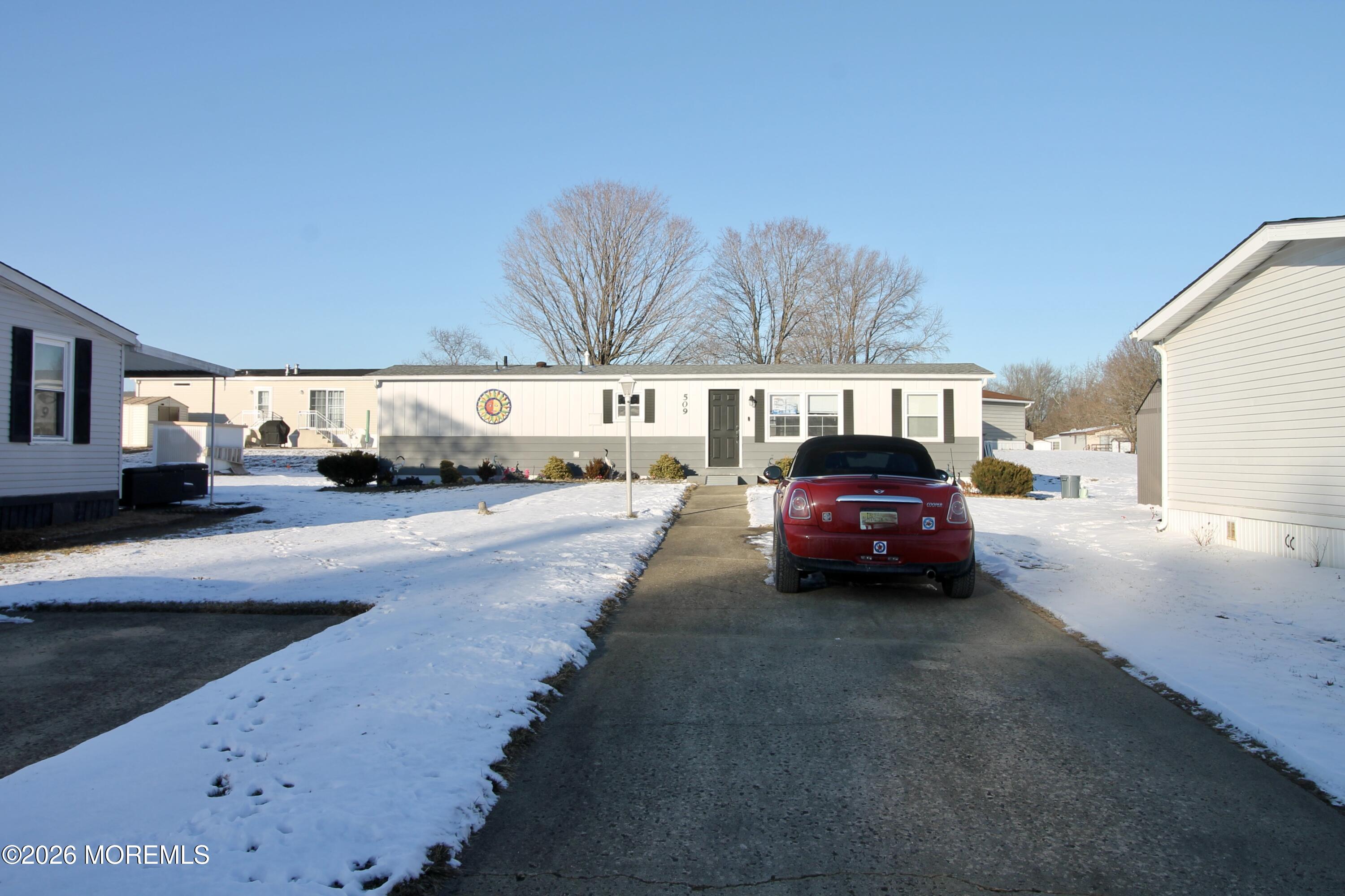 509 Rosalind Road Freehold, NJ 07728 - Photo 4 of 24 a car parked in front of a house