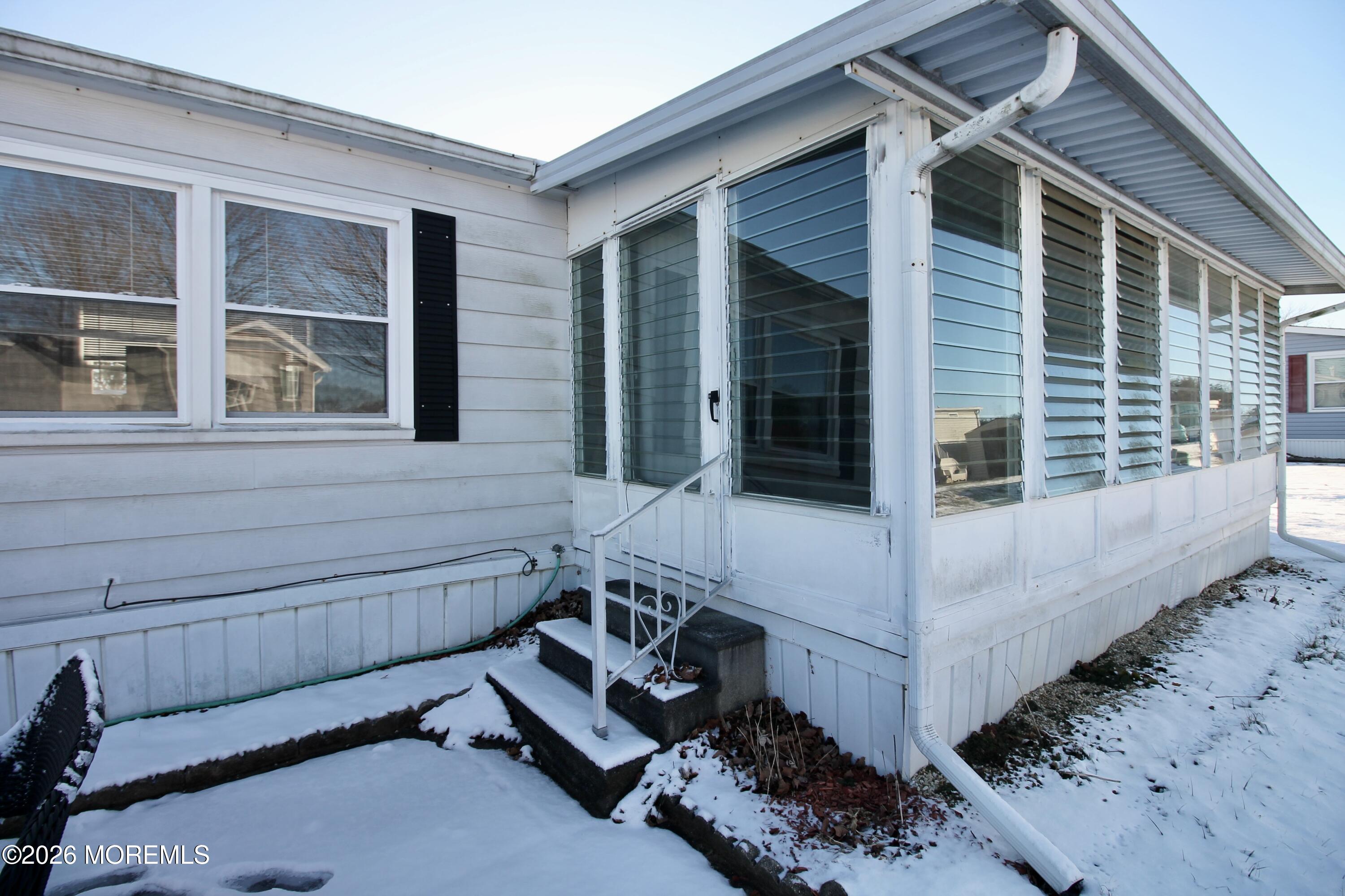 509 Rosalind Road Freehold, NJ 07728 - Photo 6 of 25 front view of a house with a chair and a yard