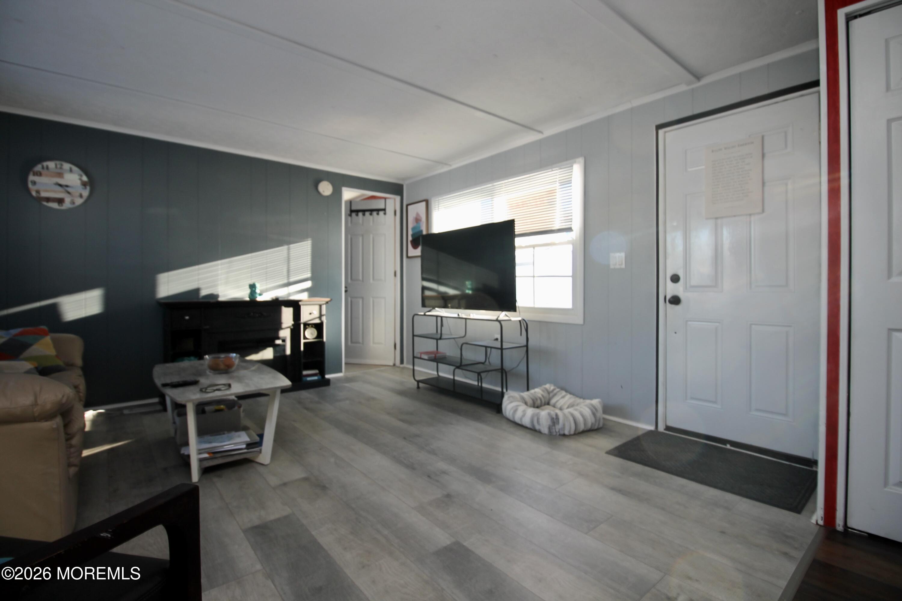 509 Rosalind Road Freehold, NJ 07728 - Photo 8 of 24 a living room with furniture and a flat screen tv