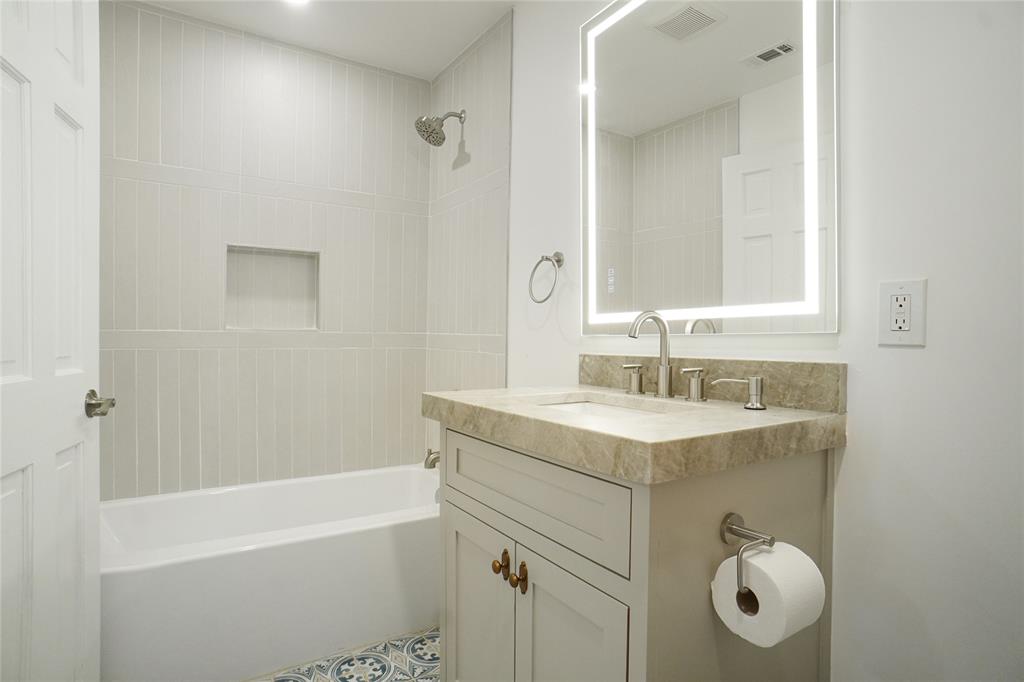 2147 Chaparral Gainesville, TX 76240 - Photo 26 of 40 Bathroom featuring vanity and shower / tub combination