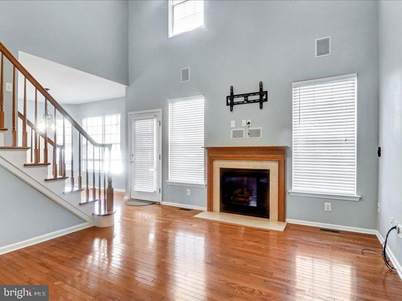 77 Cayuga Road Bordentown, NJ 08505 - Photo 11 of 37 a view of an empty room with wooden floor fireplace and a window