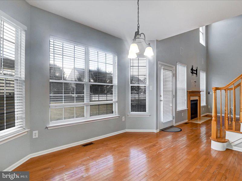 77 Cayuga Road Bordentown, NJ 08505 - Photo 13 of 37 a view of empty room with wooden floor and fan