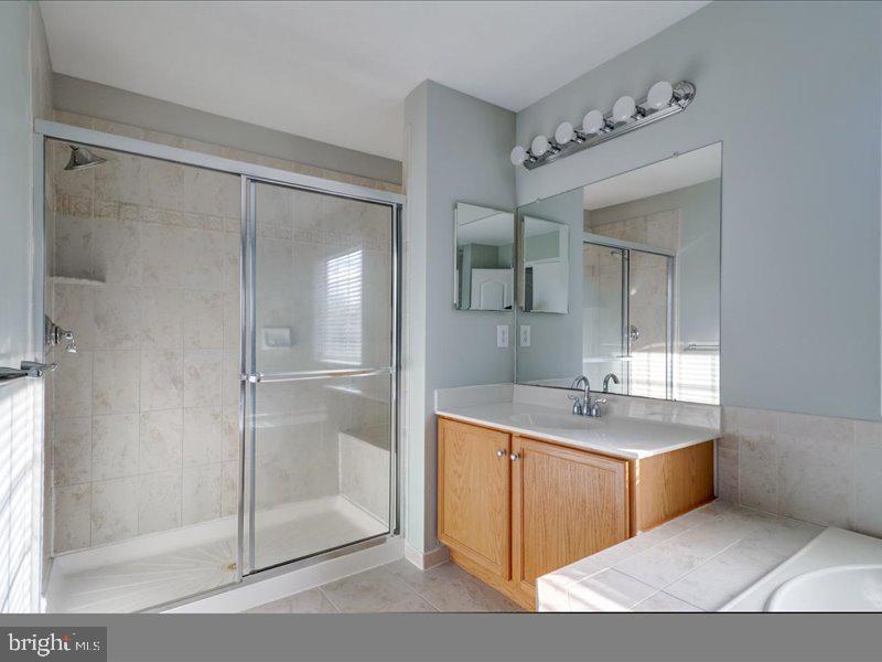 77 Cayuga Road Bordentown, NJ 08505 - Photo 25 of 37 a bathroom with a tub sink shower and mirror