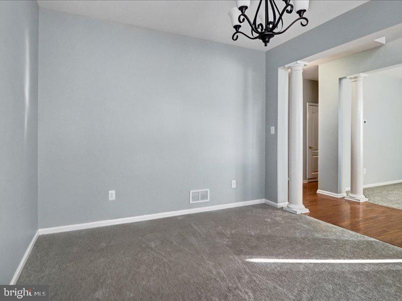 77 Cayuga Road Bordentown, NJ 08505 - Photo 6 of 37 a view of an empty room with a chandelier