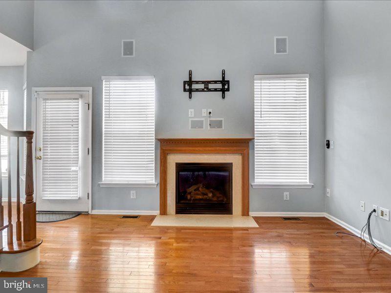 77 Cayuga Road Bordentown, NJ 08505 - Photo 10 of 37 a view of an empty room with wooden floor fireplace and a window
