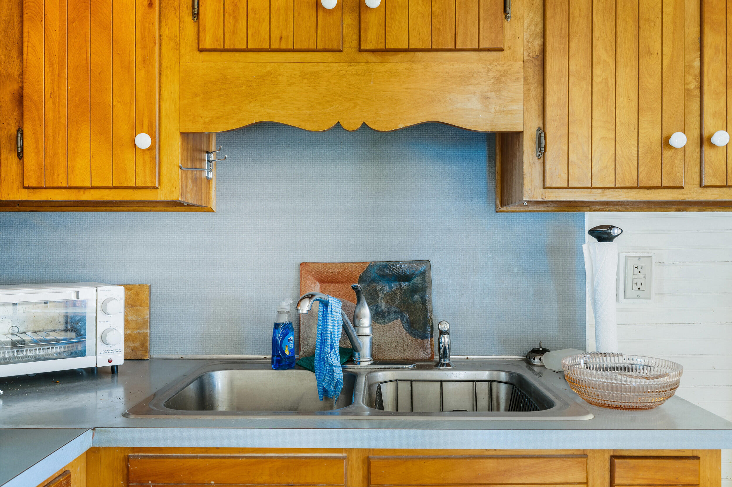 1374 Moccasin Road Thaxton, VA 24174 - Photo 23 of 81 a kitchen with a sink and cabinets