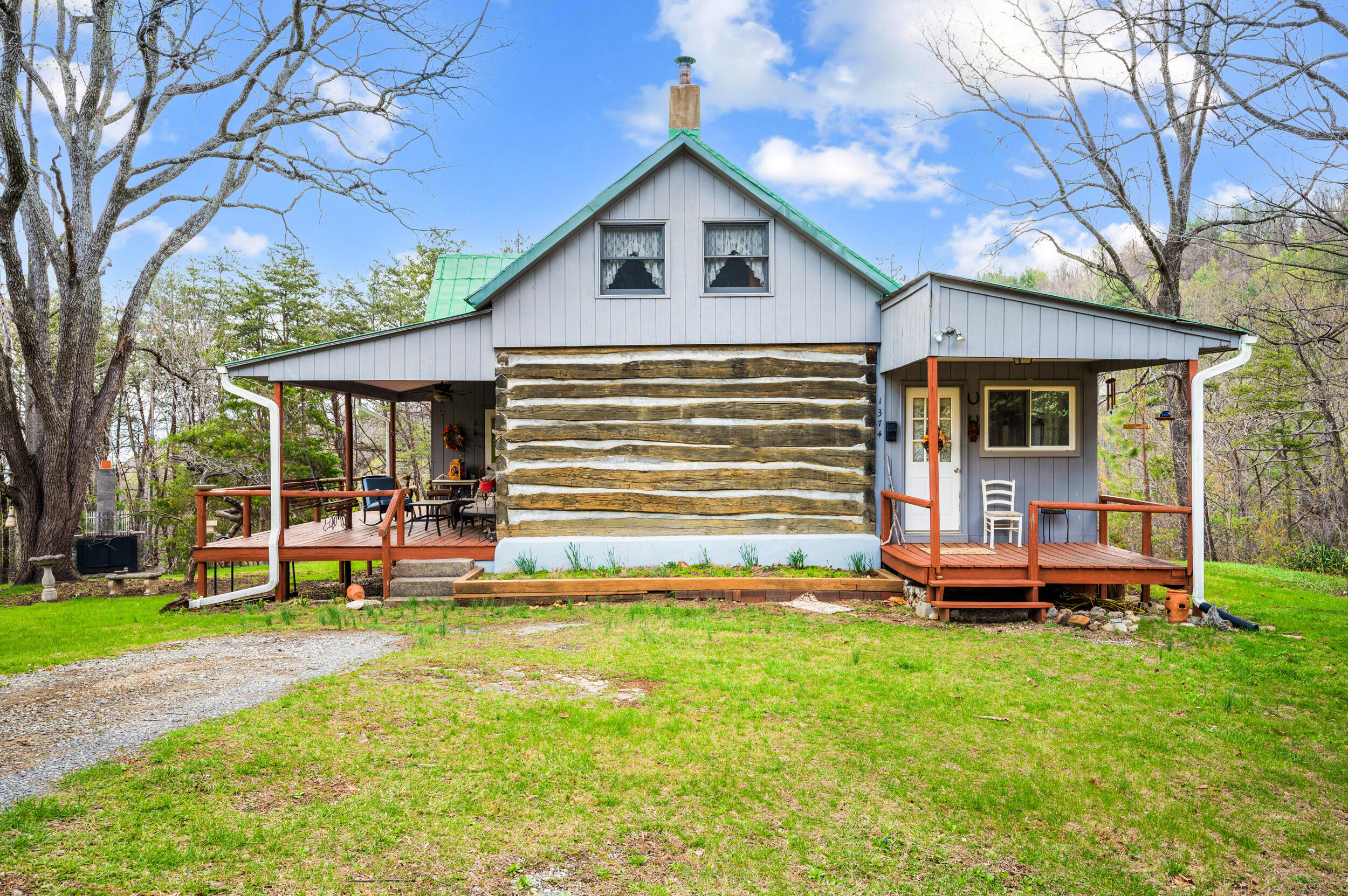 1374 Moccasin Road Thaxton, VA 24174 - Photo 4 of 81 a front view of a house with a yard table and chairs