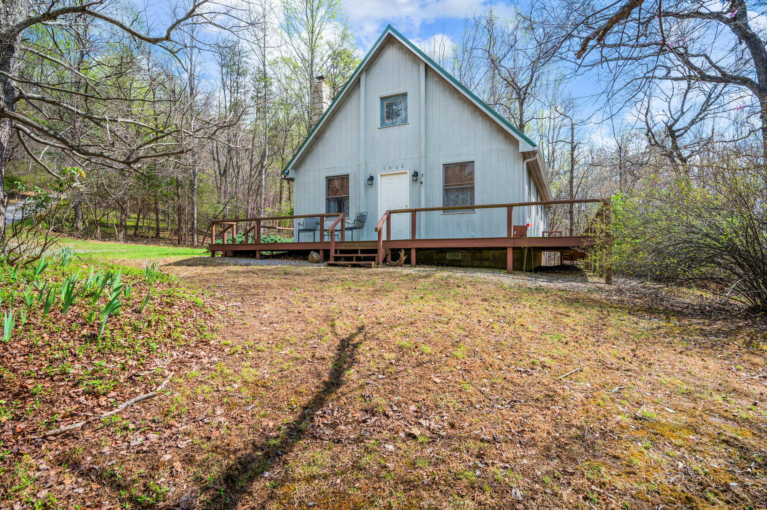 1374 Moccasin Road Thaxton, VA 24174 - Photo 75 of 81 a view of a house with a yard and sitting area