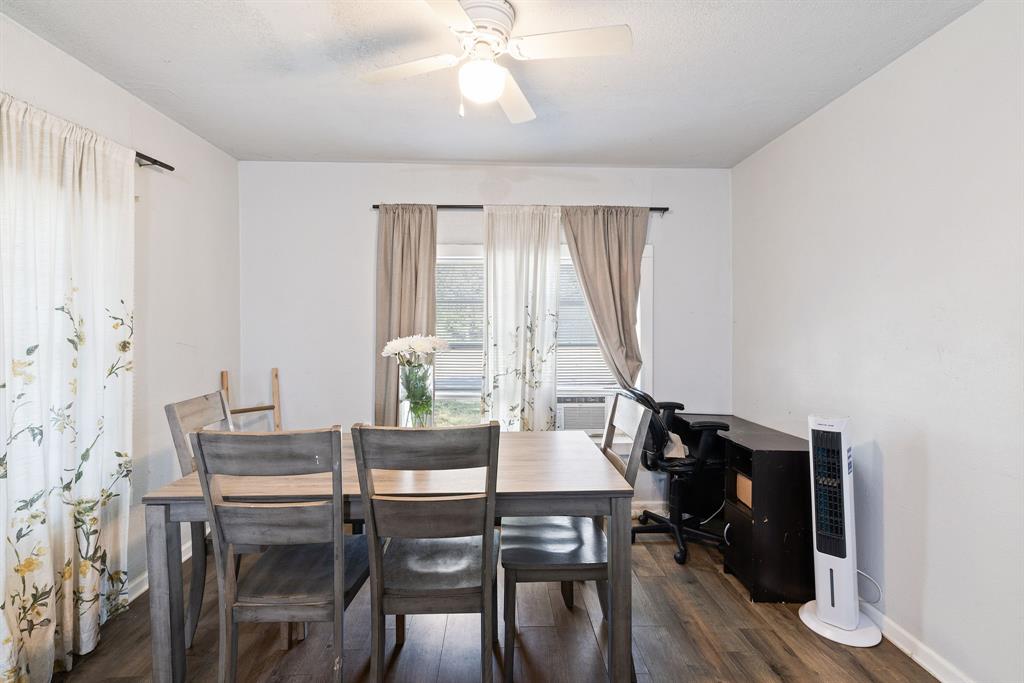 301 South Morrow Street Blue Ridge, TX 75424 - Photo 11 of 30 a view of a dining room with furniture and wooden floor