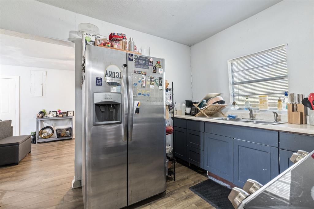 301 South Morrow Street Blue Ridge, TX 75424 - Photo 14 of 30 a kitchen with refrigerator and window